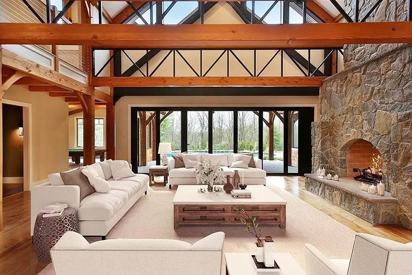 Rustic living room with cathedral ceiling stone fireplace