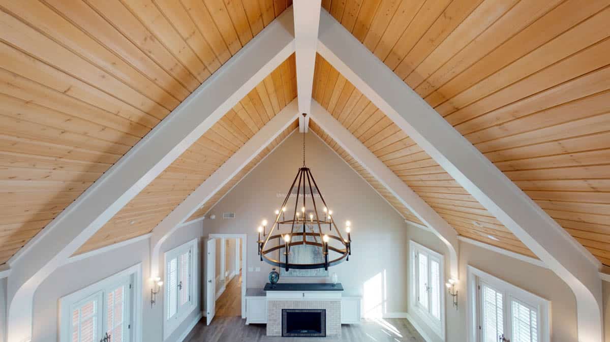 This inviting stately bedroom design with separate sitting area has