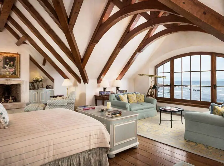 Traditional master bedroom with cathedral ceiling wood flooring