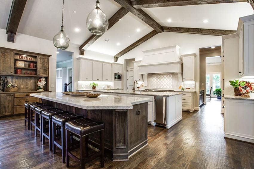 Transitional kitchen with cathedral ceiling large double islands