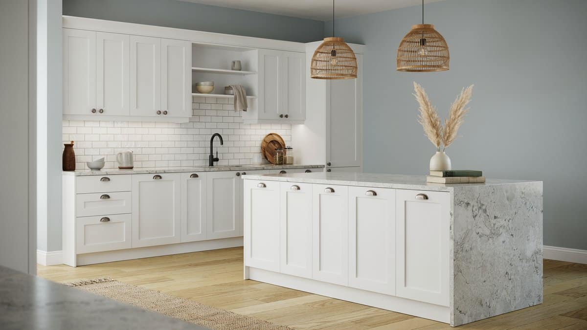 Transitional kitchen with white granite countertops, subway tile and gray blue walls