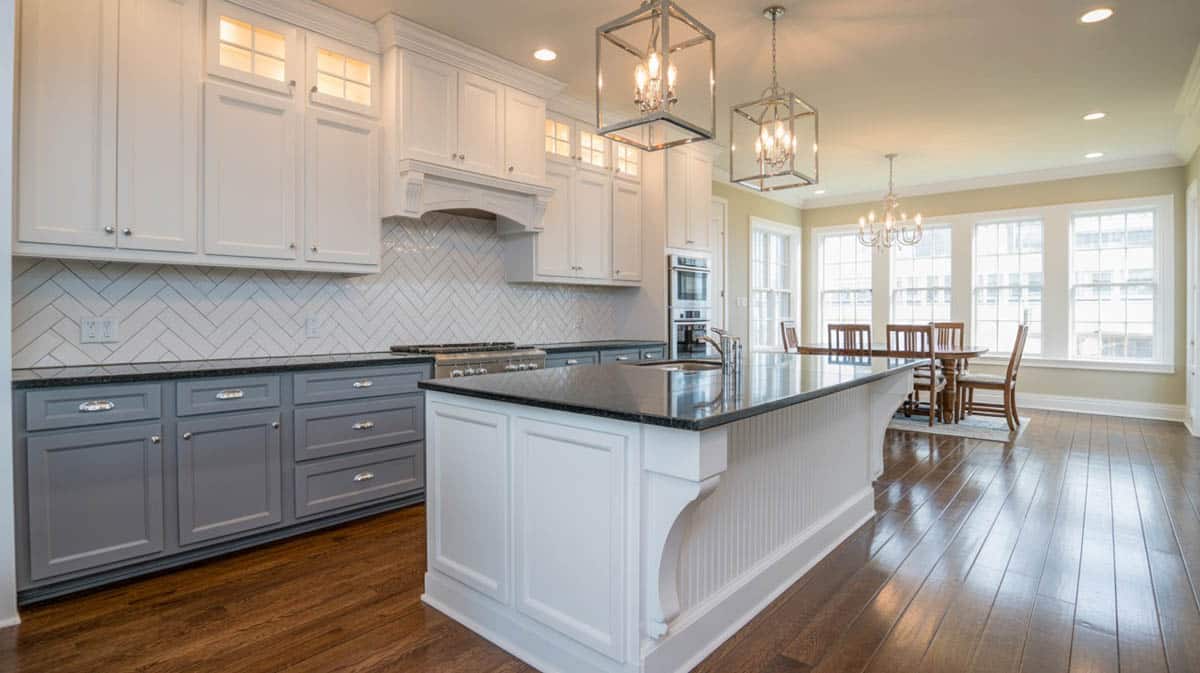 White and grey cabinetry with beadboard island