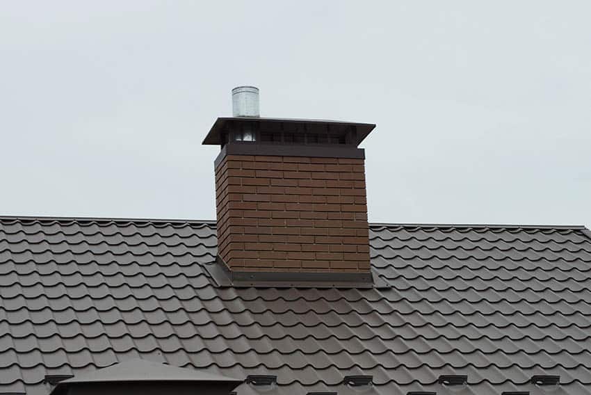 Vented gas fireplace chimney system