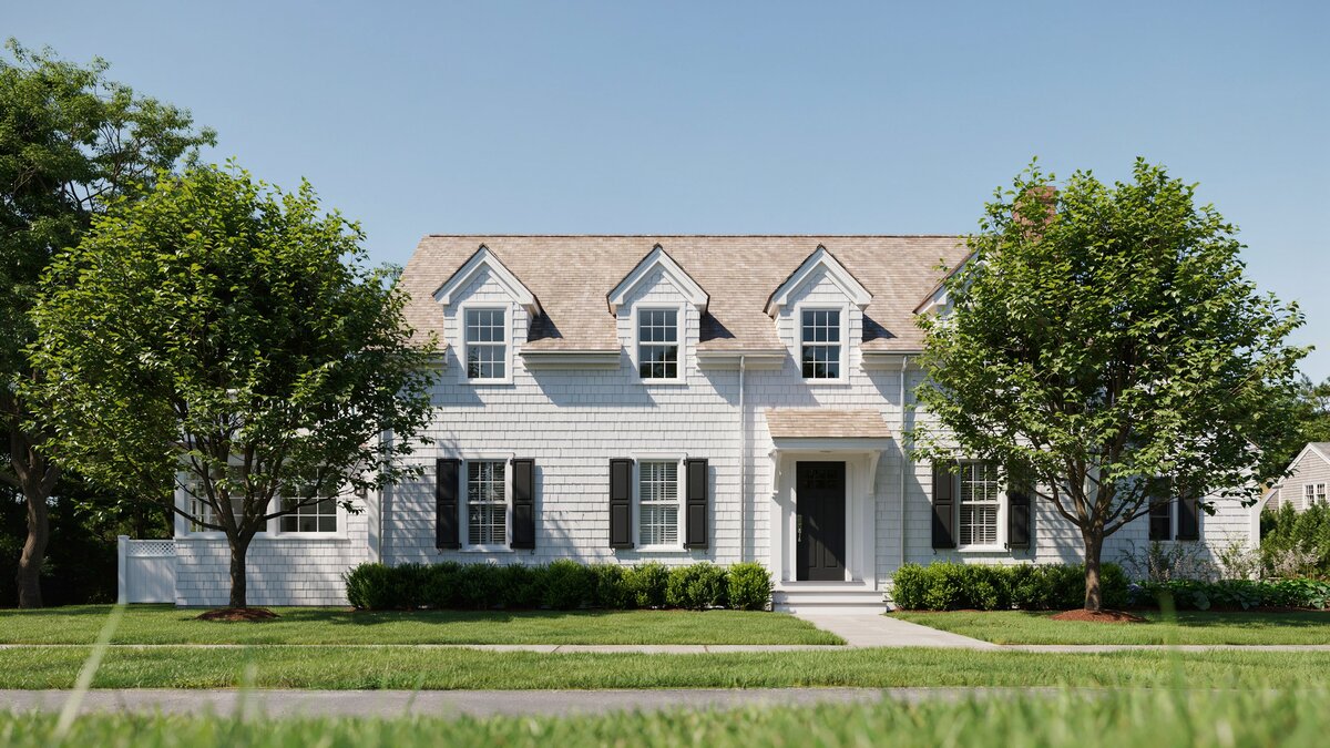 White clapboard Cape Cod with three gabled dormers and black shutters