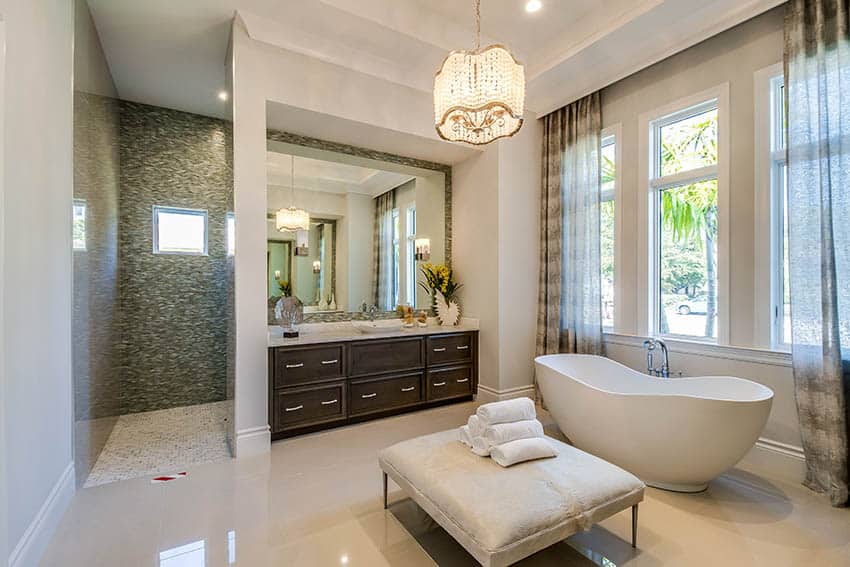 Bathroom with cool beige paint and beige floor tile with freestanding tub