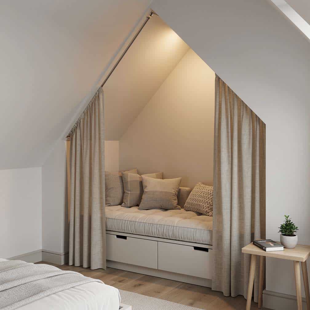 Cozy bedroom alcove with a cushioned built-in sitting nook and linen curtains that can be drawn for privacy