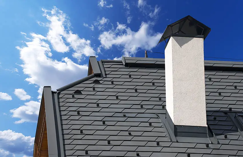 Chimney with metal snow guard