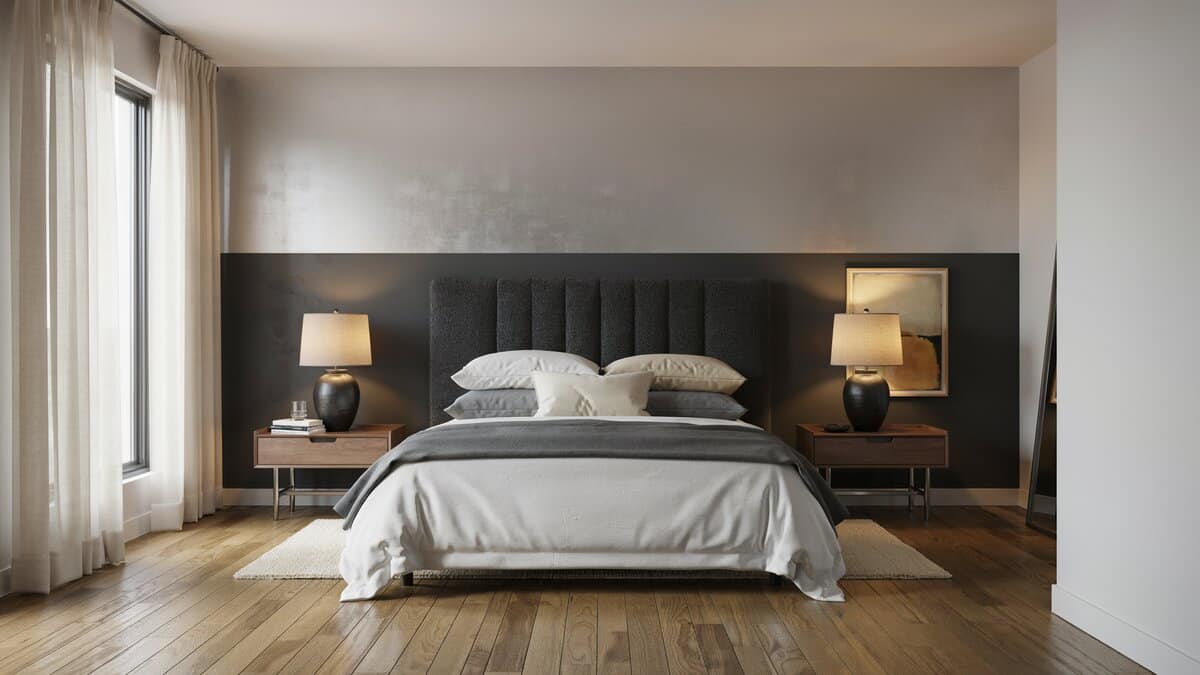 Contemporary master bedroom with cal king bed and black and silver two tone accent wall