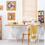 Craft room with sewing supplies and easel desk