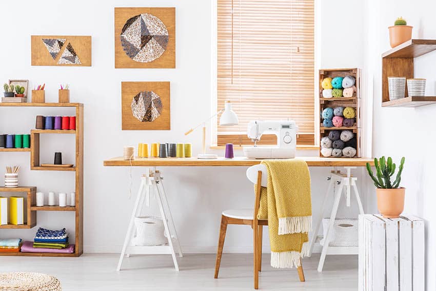 Craft room with sewing supplies and easel desk