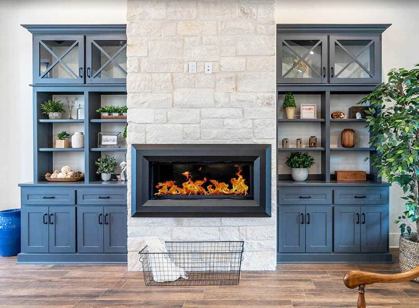 Electric fireplace with stone chimney and built in shelving