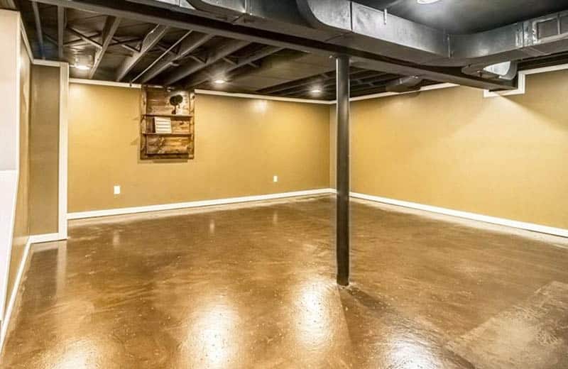 Finished basement with gold epoxy floors