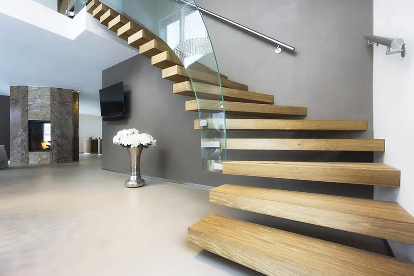 Stairs with stainless steel handrails and tempered glass railings