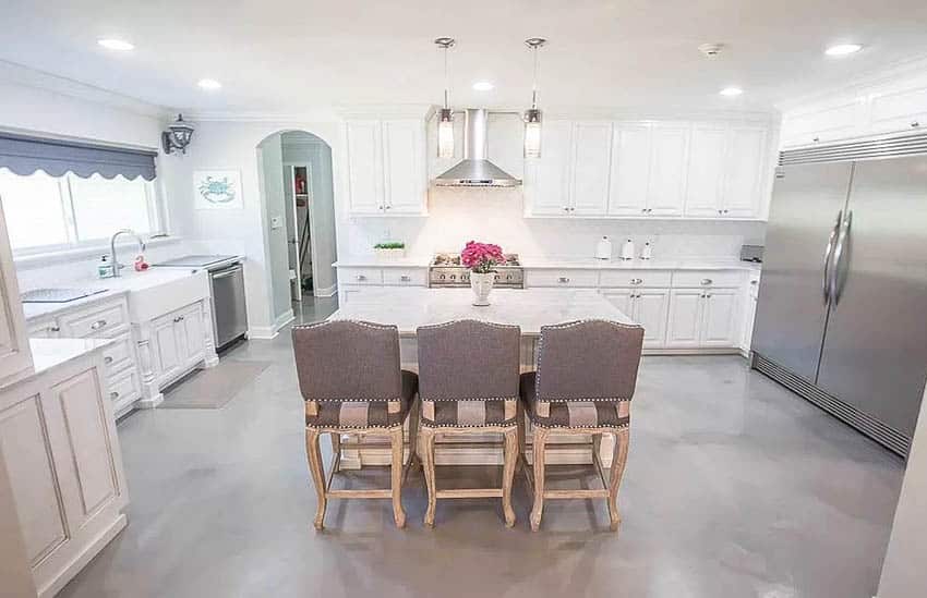 Kitchen with gray metallic epoxy floors white cabinets