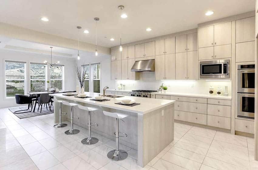 Kitchen with porcelain tile, bleached wood cabinets and quartz countertops