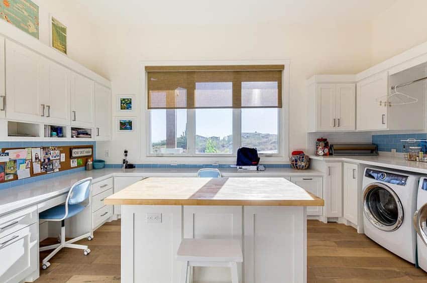 Laundry room for crafts with island and built in cabinets