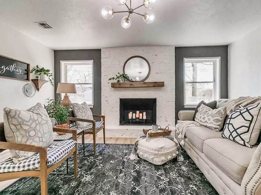 Living room with gray accent wall and stone fireplace