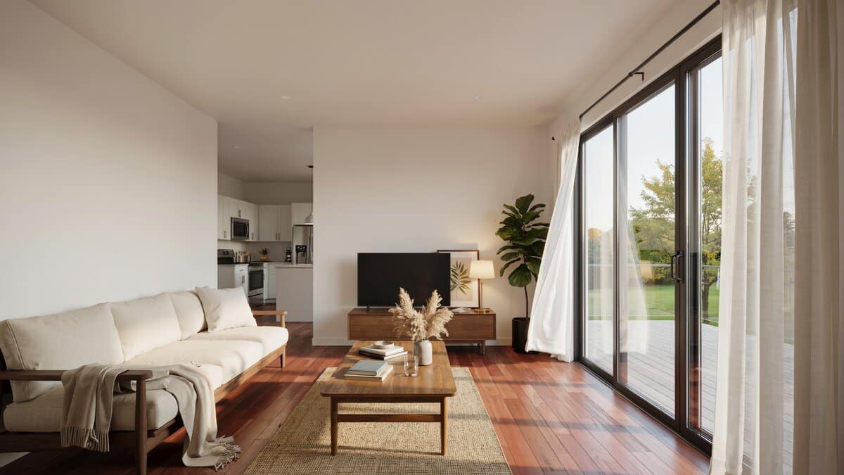 Open living room with white sofa, sliding glass doors and jute rug