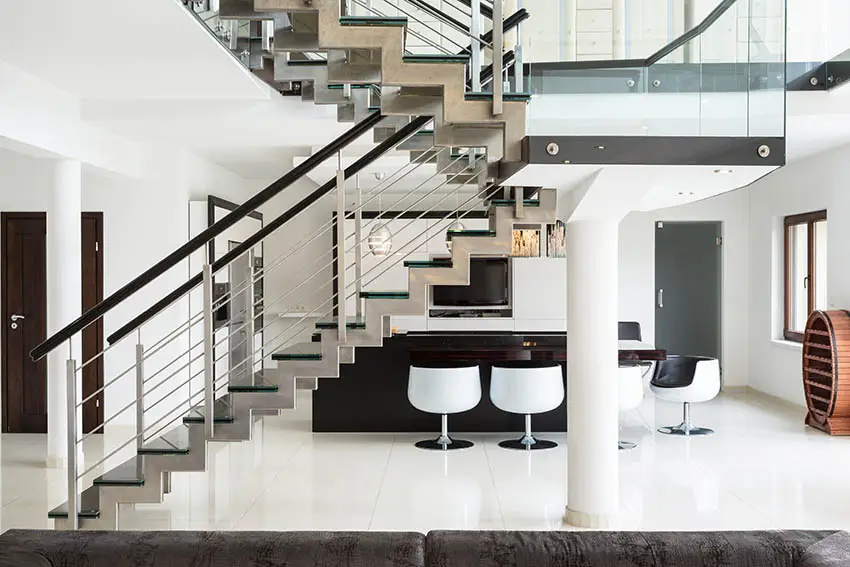 Stairs with stainless tension wires and black rails 