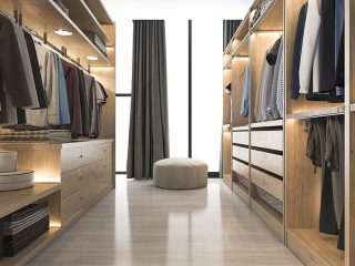 Modern light wood walk in closet with under shelf lighting