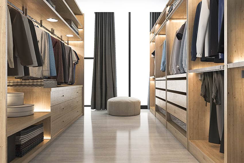 Modern light wood walk in closet with under shelf lighting