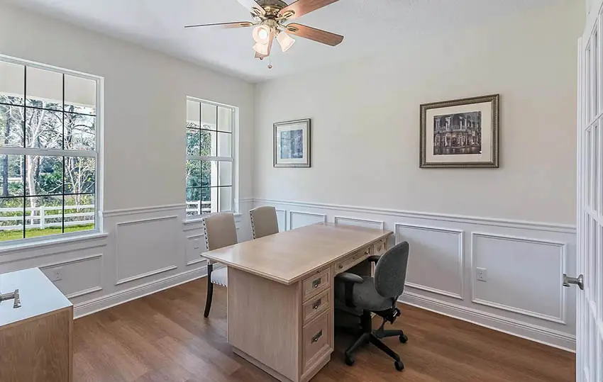 North facing home office with sherwin williams summer white paint and wainscoting