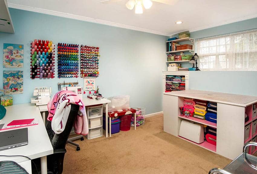 Sewing room with shelf island storage and corner desk