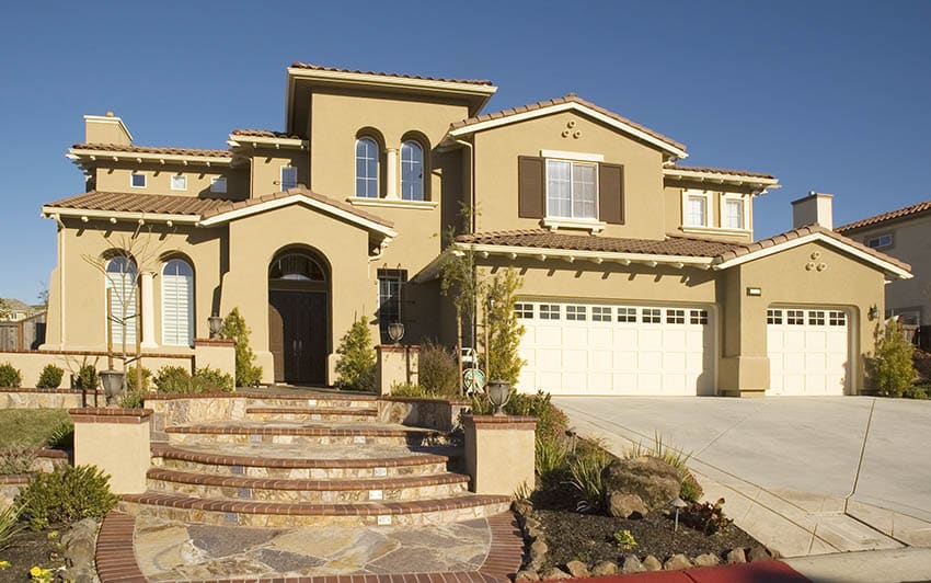 Stucco house exterior in front yard