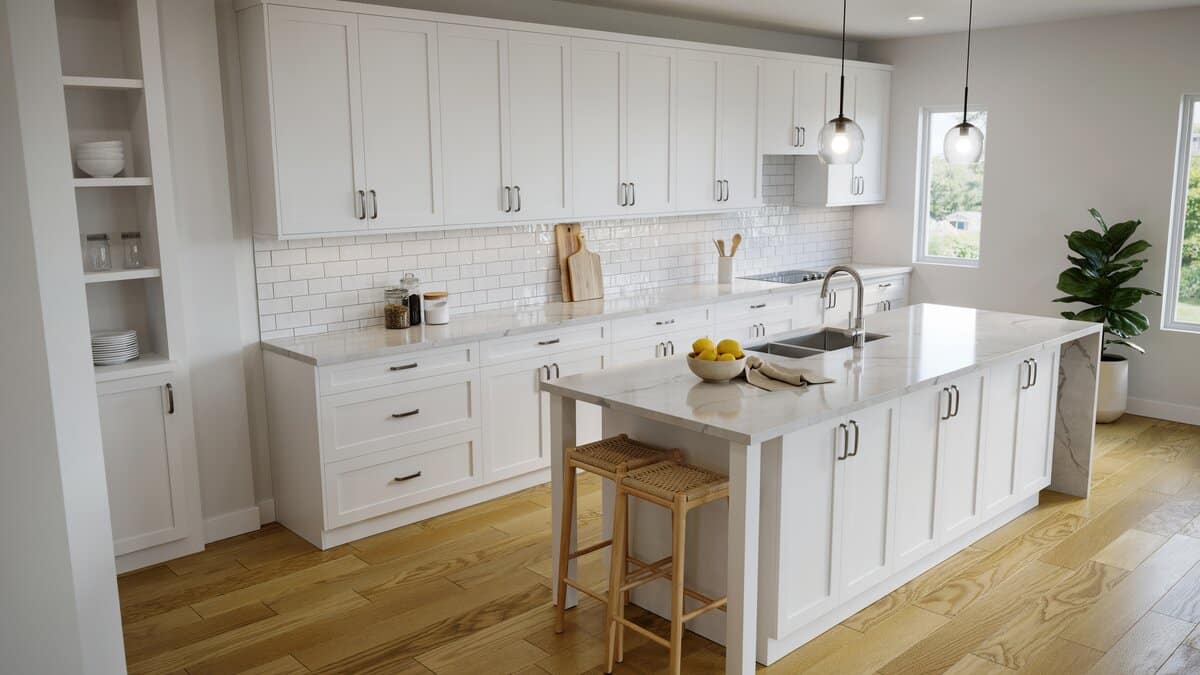 White cabinet kitchen with light hardwood flooring, waterfall quartz island, and natural light