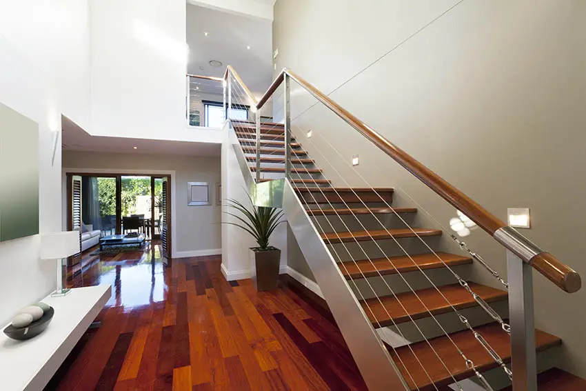Cherry wood stairs with steel supports and polished wood rail