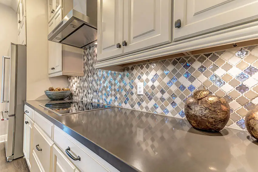 Kitchen with arabesque tile and gray quartz countertop