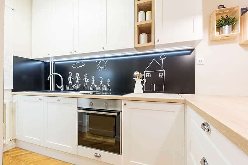 Kitchen with chalkboard paint backsplash white cabinets