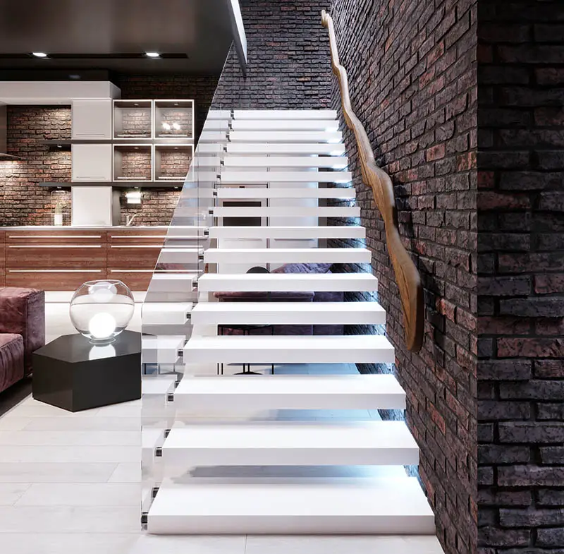 Thick white staircase treads, brick wall and open shelves