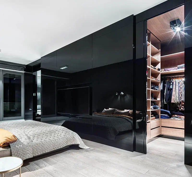 Modern high gloss black closet door to walk in closet