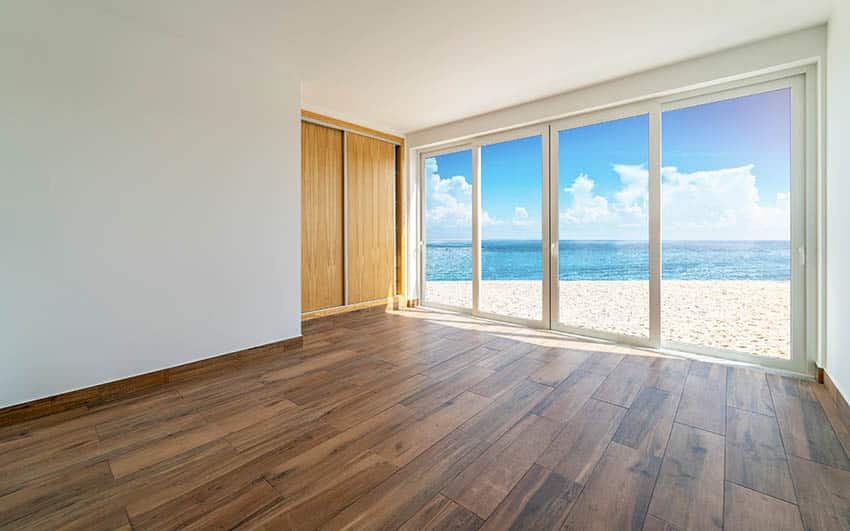 Ocean view bedroom with wood strip pattern flooring design