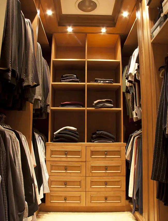 Small walk in closet with recessed lighting