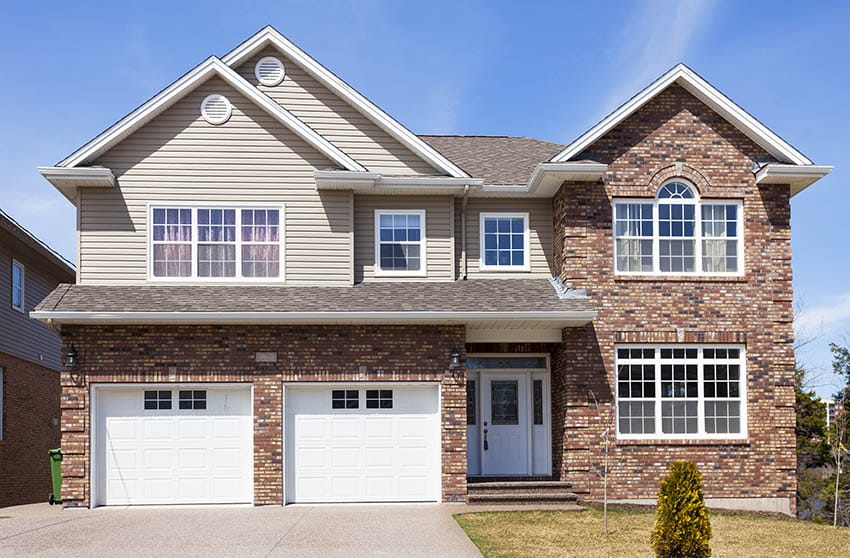 Brick house with tan paint color