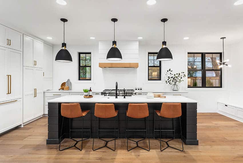 Contemporary kitchen with island black sink white quartz countertops black pendant lights white cabinets