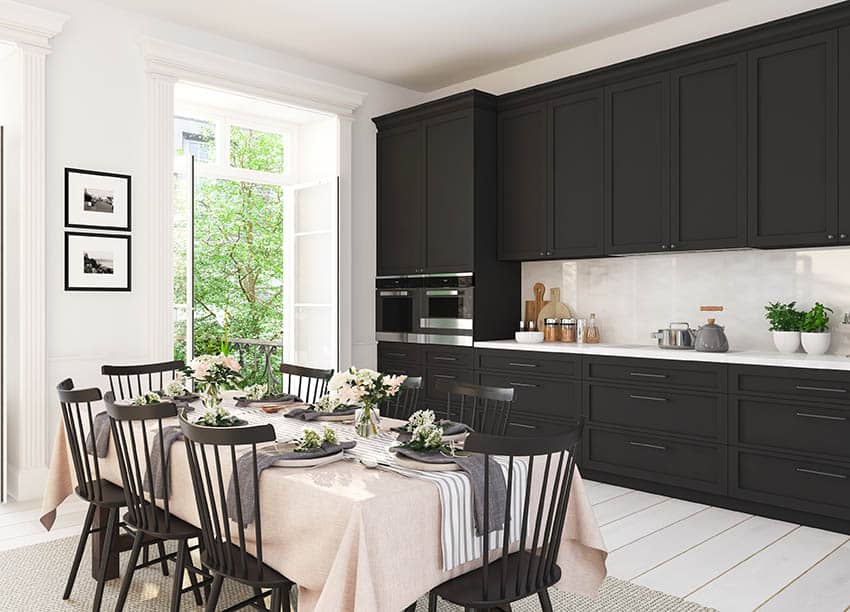 Contemporary single wall kitchen with black cabinets balcony door
