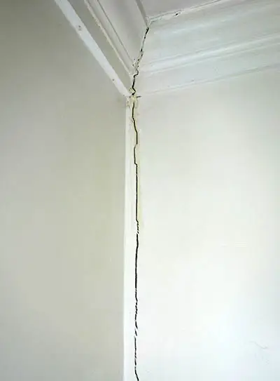 Crack in wall that meets the ceiling