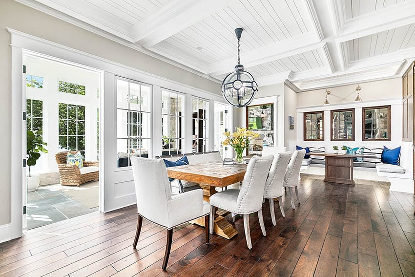 Dining room with medium wood floors and greige paint