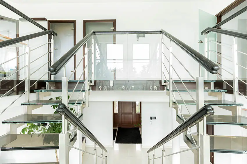 Double glass staircase with wood railing
