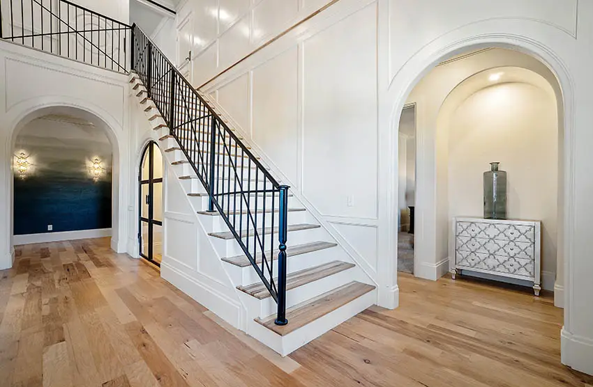 House entryway with staircase metal hand rail