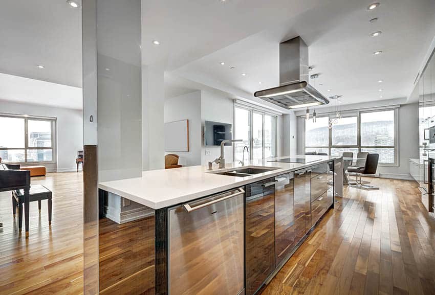 Kitchen island with electric cooktop stove, sink and mirror cabinets