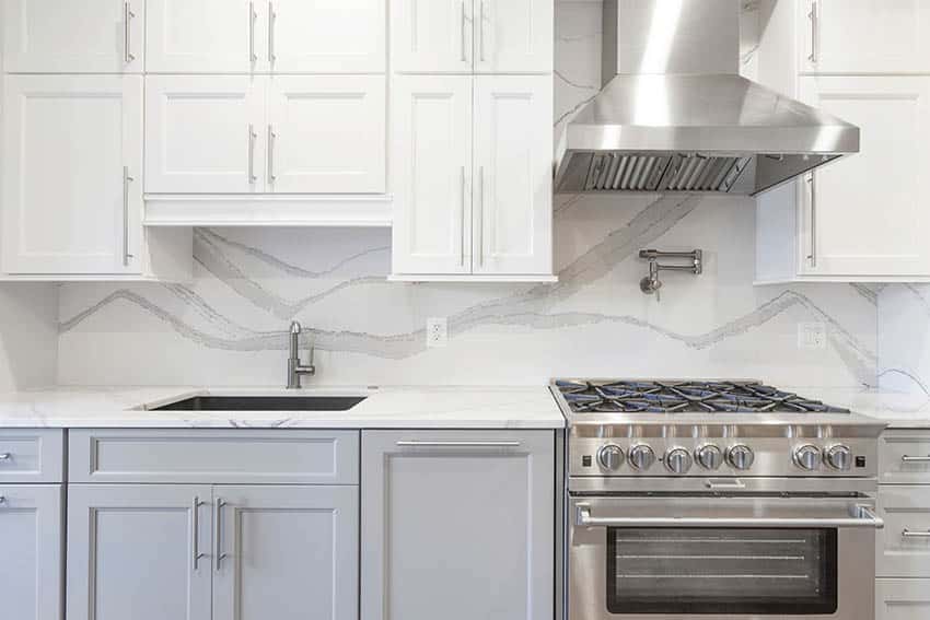 Kitchen with full height quartz and two tone cabinetry