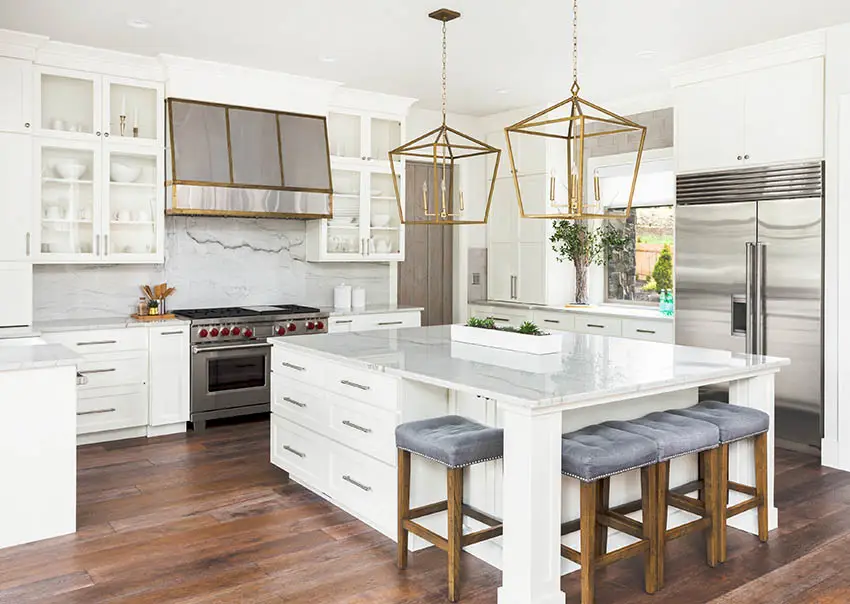 Kitchen with full slab marble style quartz backsplash matching countertop island