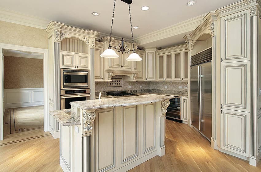 Kitchen with island corbels and range hood corbels with antique cabinets