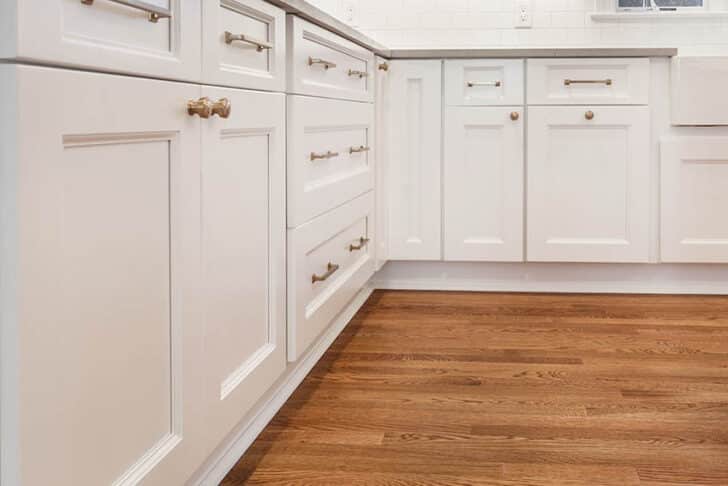 walnut wood cabinet pulls on white cabinets