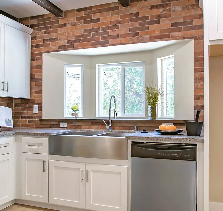 Kitchen with large bay window above sink