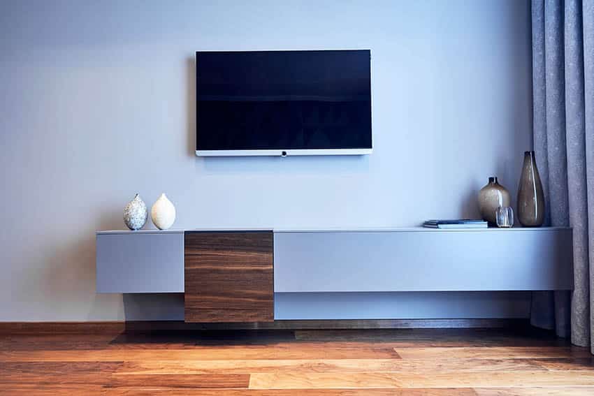 Living room with cherry wood floors and light blue paint